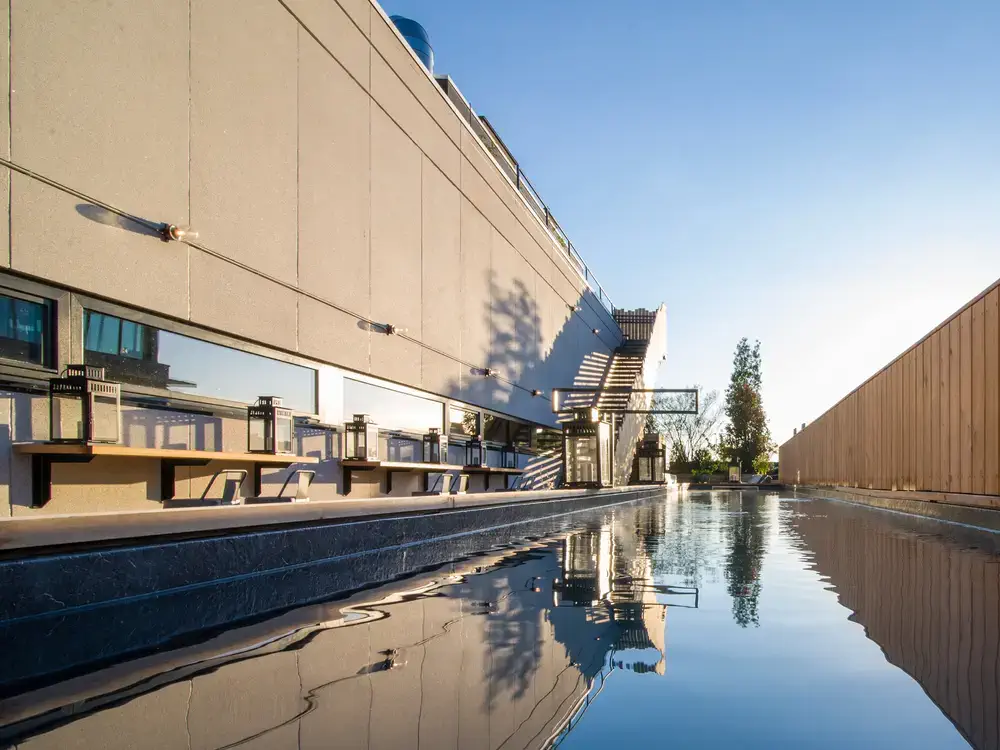 exterior of building surrounded by water - Xotels Hotel Budget Blog