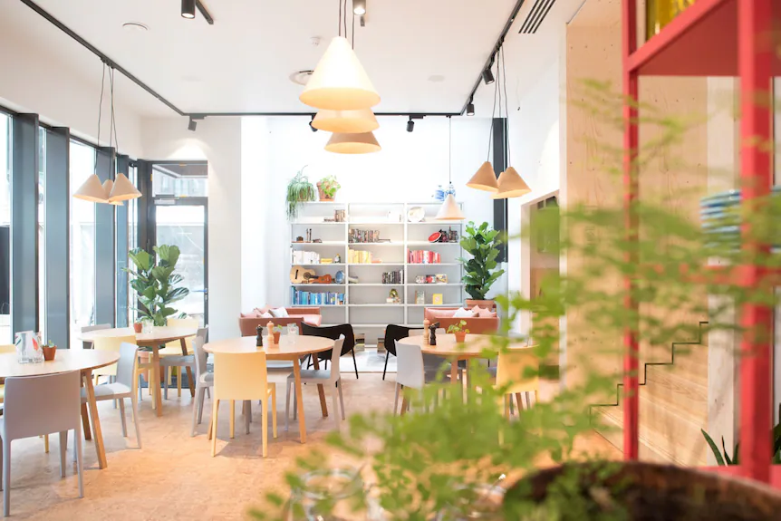 A hotel lobby that has been converted into a coworking space illustrates creative hotel sales strategies to monetize underutilized areas.
